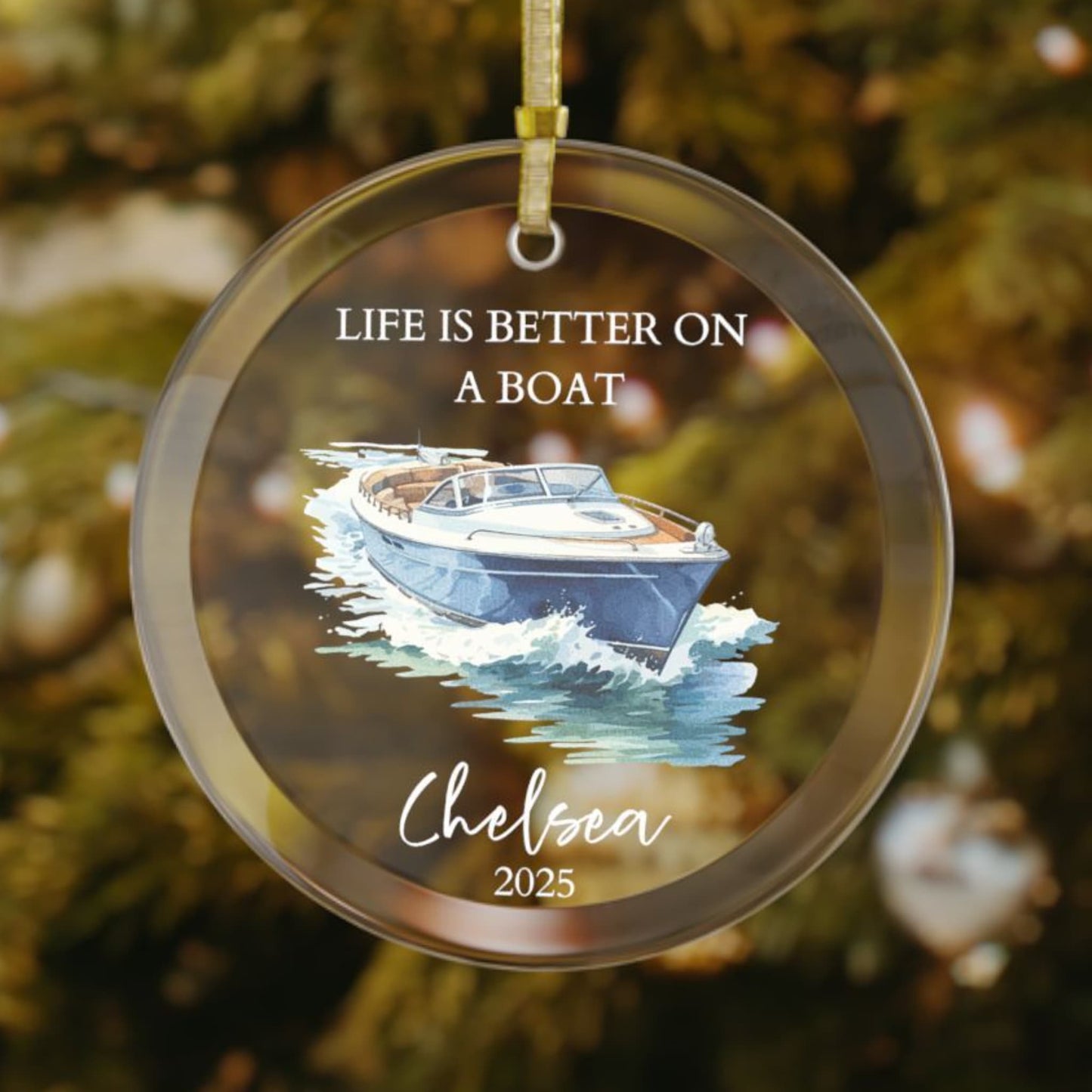 Personalized glass Christmas ornament featuring a sleek blue and white speedboat cruising through waves with the phrase "Life Is Better On A Boat," customized with name and year.