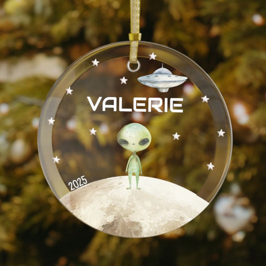Custom alien Christmas ornament featuring a green alien, UFO spaceship, silver stars, and moon – personalized with a name and the year. A fun holiday gift for space-loving kids and sci-fi fans.