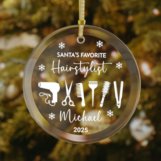 Personalized glass Christmas ornament for hairstylists featuring an all-white design with salon tools, snowflakes, custom name, and "Santa’s Favorite Hairstylist" text.