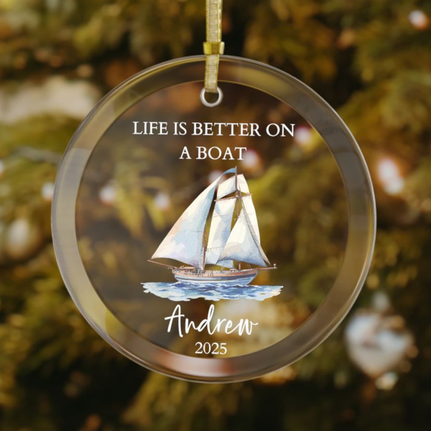 Personalized glass Christmas ornament featuring a classic sailboat with white sails gliding across the ocean, with the phrase "Life Is Better On A Boat," customized with name and year.