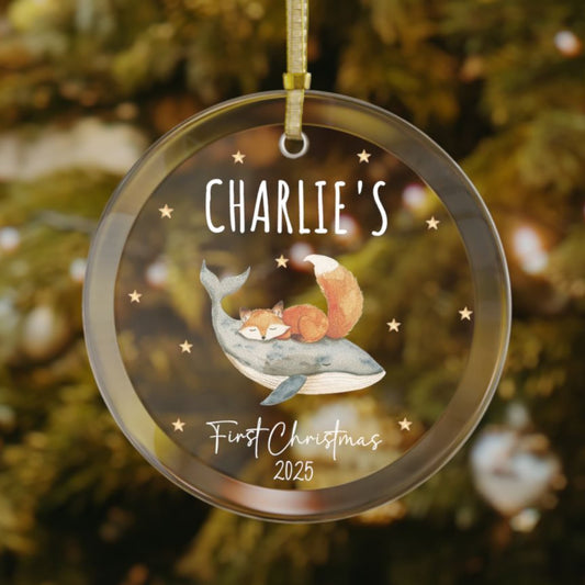 Personalized baby’s first Christmas glass ornament featuring a sleeping fox and whale design, stars scattered in the background, custom name and year keepsake, newborn Christmas gift
