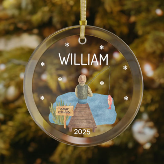 Personalized fishing Christmas ornament featuring a man sitting on a dock with a fishing rod, "Gone Fishing" sign, snowflakes around the design, custom name at the top, and the year at the bottom.