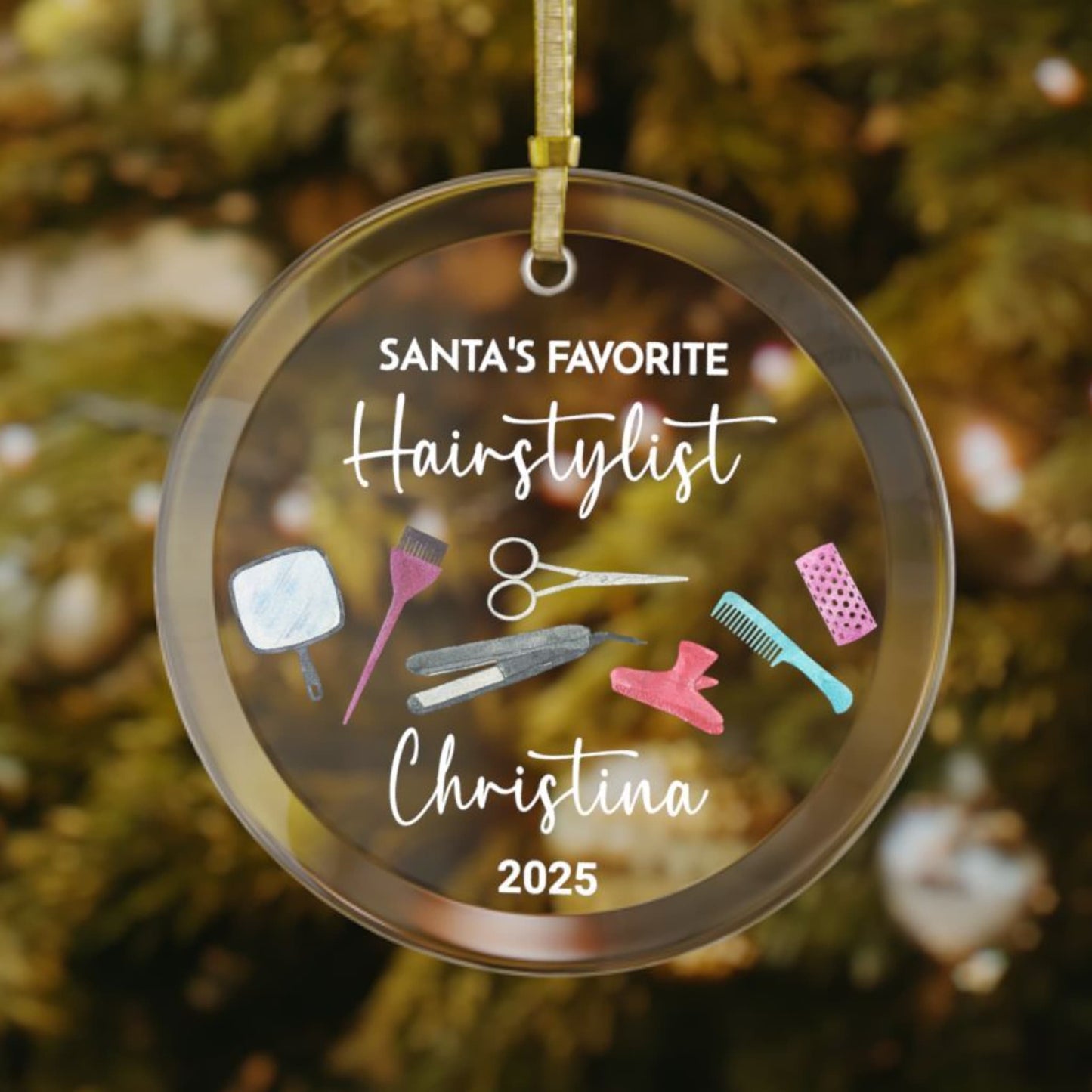 Personalized glass Christmas ornament for hairstylists, featuring colorful salon tools, a custom name, and the phrase "Santa’s Favorite Hairstylist" at the top.


