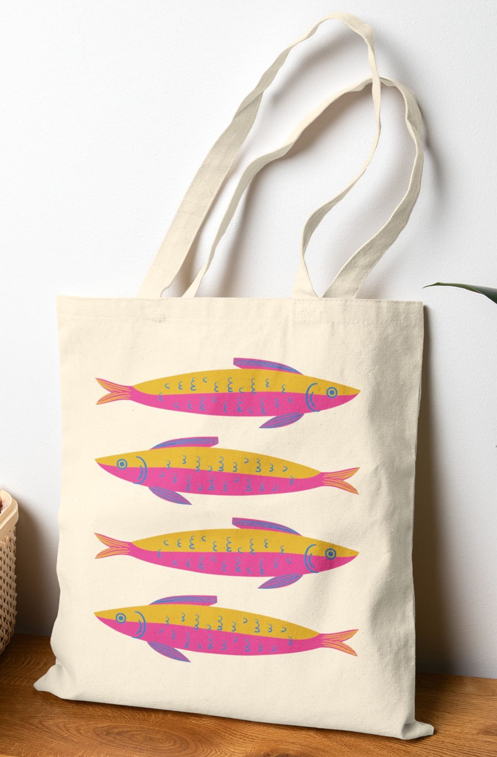 Colorful sardine print cotton canvas tote bag with pink and yellow fish – reusable coastal beach bag for ocean lovers, markets, and everyday use.